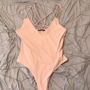 Pink strappy bodysuit